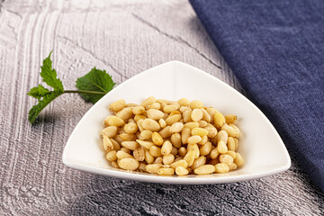 Peeled cedar nut in the bowl