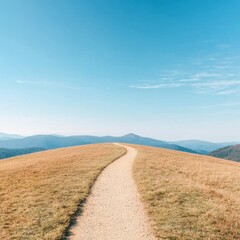 Fototapeta premium Serene Mountain Path Winding Through Golden Grasslands Under a Clear B