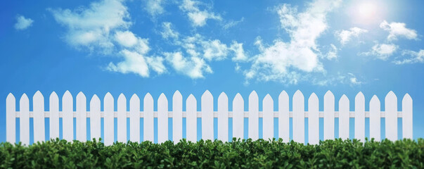 White Picket Fence with Clear Blue Sky