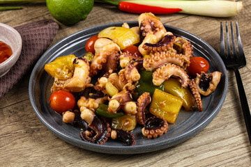 Roasted octopus with vegetables and oil