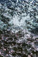This is a close up image showing a splash of water in a body of water
