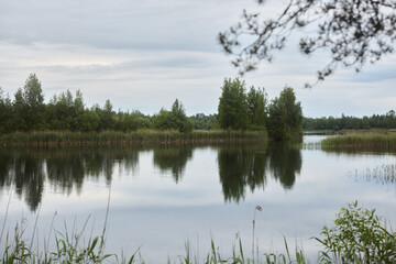 A Tranquil and Picturesque Waterside Landscape with Beautiful Reflections in Nature