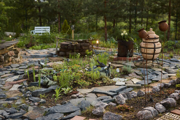 A Tranquil Garden Oasis featuring Beautiful Natural Stone Elements and Unique Features
