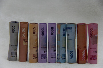 Indonesian rupiah banknotes, five thousand to one hundred thousand rupiah, rolled up