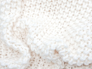 A cozy white knitted plaid background with soft, minimalist details and woven charm.