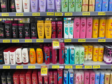 Various brands of shampoo bottles and conditioner, sold at Indonesia, displayed on supermarket shelf, in October 7th 2023 on Semarang, Indonesia