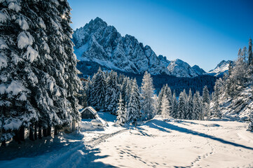 Ice Dawn in Sappada. Walk through ancient villages and dream mountains. Dolomites.