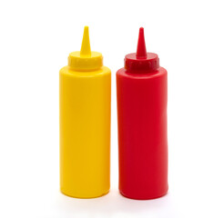 Squeeze bottles of mustard and ketchup on a plain white back ground