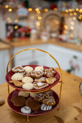 Christmas cookies and Interior decorated kitchen with Christmas decor on background. Christmas in kitchen table setting.