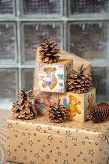 Charming Christmas arrangement featuring hand-painted wooden blocks with teddy bear illustrations,...