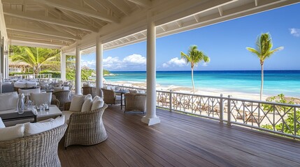 Obraz premium A serene beachfront restaurant with a view of the ocean and palm trees.
