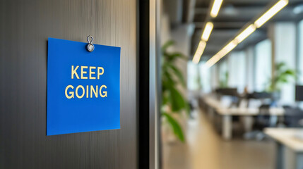 Keep Going motivational message note, inspirational success reminder text, positive perseverance sticky note concept