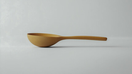 Side view of a small wooden spoon with a rounded bowl and long handle, natural wood finish