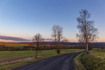 A country road at sunset. The last day of autumn.