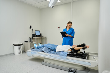 A caring doctor in a lab coat assists her patient on the MRI machine, ensuring comfort and safety.