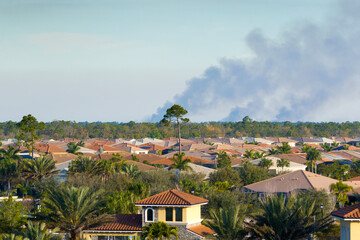 Air contamination with burning smoke from prescribed fire close to suburban area in Florida, USA