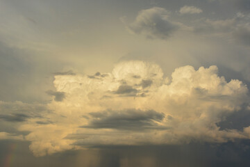 a sky with stormy clouds and a rainbow sky before storm