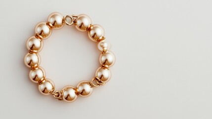 Elegant Golden Beads Bracelet: This close-up shot captures the exquisite details of a bracelet composed of lustrous golden beads, set against a smooth, uncluttered backdrop.