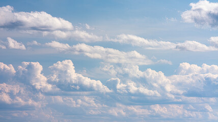 Vast Sky with Fluffy White Clouds Against Light Blue Backdrop, Clear Day with Varying Cloud Sizes and Shapes, Light and Airy Atmosphere, Peaceful and Pleasant Weather Scene