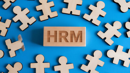 Obraz premium HRM: Human Resources Management, Employee Engagement, Recruitment, and Organizational Growth, human resources management concept. Wooden figures on the blue background, hrm copy space, hrm background