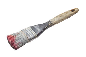 a paint brush with red paint on it