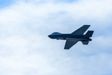Sleek Military-Grade Drone in Flight Against Clear Sky