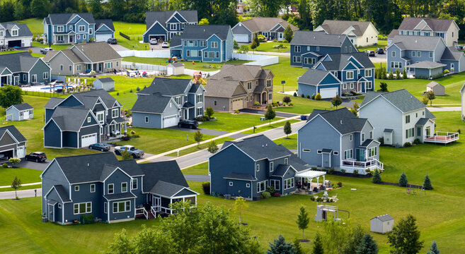 Top view of expensive two story private houses in Rochester NY suburbia. New family homes in upscale community. Real estate development in american suburbs