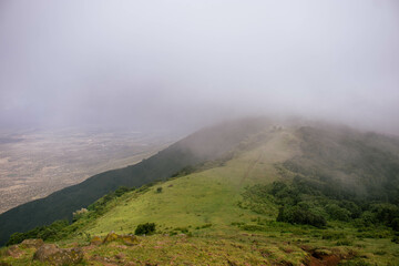 A view of the hills on a foggy cloudy morning. 