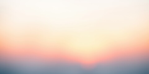 Fototapeta premium A soft, pastel sky with a blurred sunset horizon, showcasing a dreamy and tranquil atmosphere