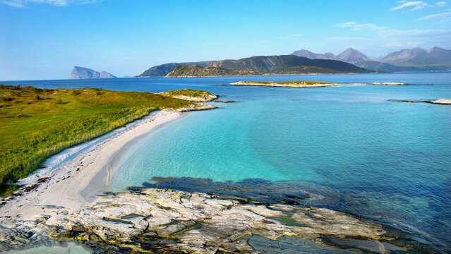 Norway, Senja island. Scenic sea coastline with white sand beach.