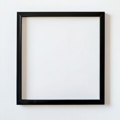 Black frame on white wall, minimalist design with ample empty space.