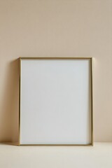 Blank gold-framed canvas on beige wall