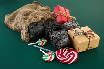 Epiphany Befana's stocking with sweet coal and candy. Italian Epiphany day.