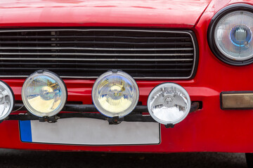 Car front with headlight and grill