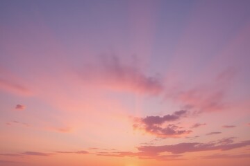 Fototapeta premium Vibrant sunset with pastel sky and radiant clouds creating a serene and tranquil atmosphere.