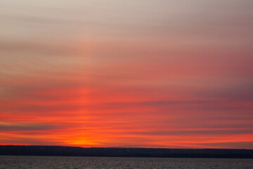 a sunset with clouds and a sunset on the horizon.