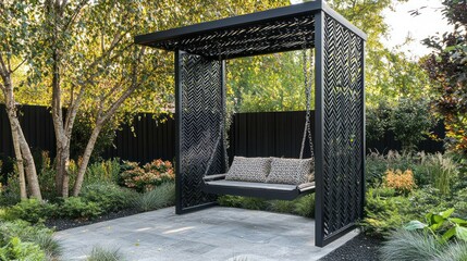 Fototapeta premium Modern black metal swing hanging under pergola in garden.