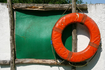 Old lifebuoy on the wall