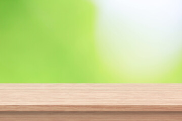 Wood floor with blurred trees of nature park background