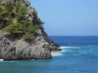 Coastal cliffs and clear blue waters