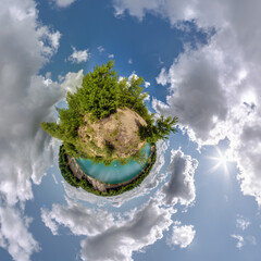 simple little tiny planet without buildings in blue sky with sun and beautiful clouds....