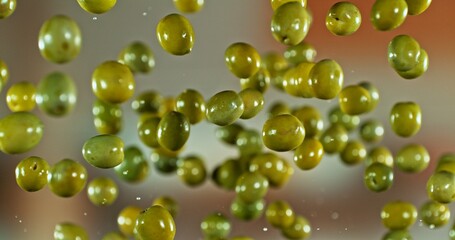 Freeze Motion of Flying Green Olives.