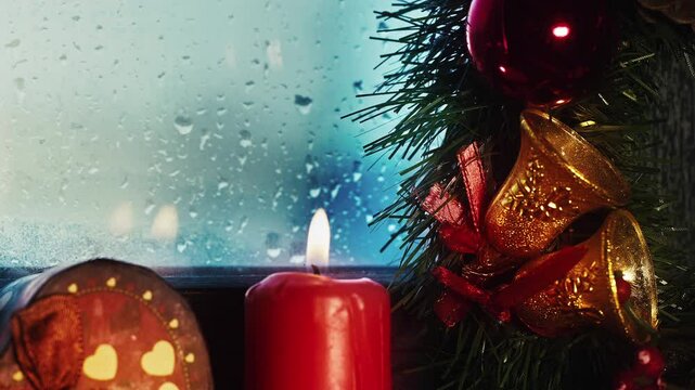 Holy Christmas New Year Eve Decoration and Gift Boxes on Candle Light Near the Window Glass in Rainy Day