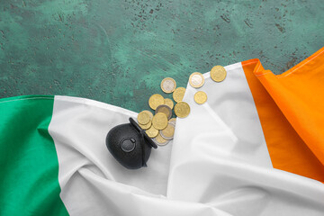 Flag of Ireland and pot with coins on green background