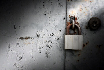 Old rusty lock on metal doors. Lock on the door with an empty place for an inscription