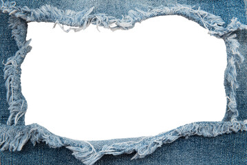 Hole in denim on a white background. Ripped jeans