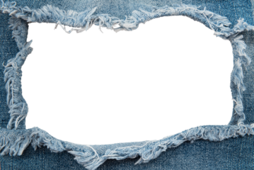 Hole in denim on a white background. Ripped jeans