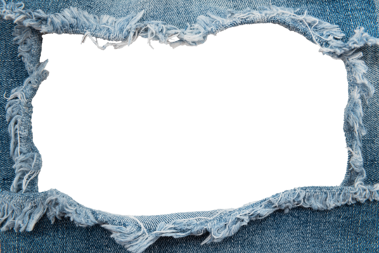 Hole in denim on a white background. Ripped jeans