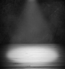 Spotlit floor and wall