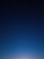 Starry night sky with countless tiny lights scattered across the horizon, cosmos, twinkling